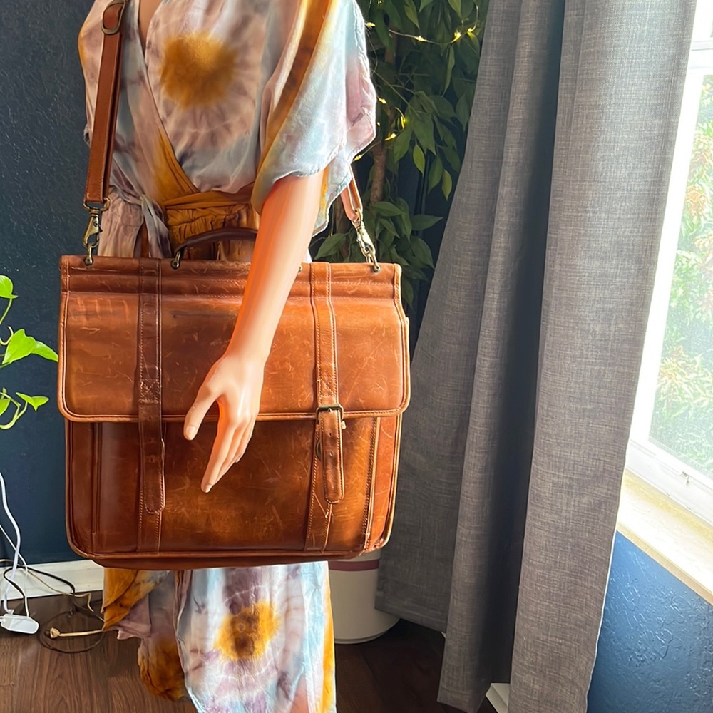 Vintage Wilsons, cognac leather messenger bag.